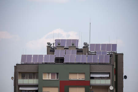 Solar panels installed on roof of the appartment house. Good lighting conditions, Naturally soft lightの写真素材