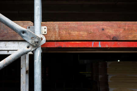 Details of scaffolding on the wall of a newly constructed public building. Photo taken in cloudy...