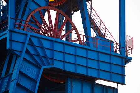 The elevator of the hoist shaft in the black coal mine. Coal mine hoist against the sky. Photo taken under natural lighting conditionsの写真素材