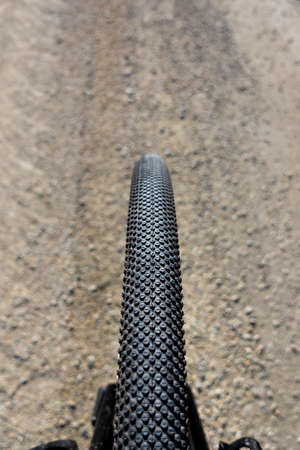 Close up of a gravel bike tire. Adventure on a gravelike bike. Photo taken on a beautiful sunny day.の写真素材