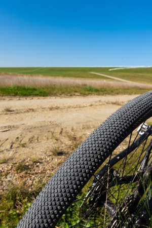 Close up of a gravel bike tire. Adventure on a gravelike bike. Photo taken on a beautiful sunny day.