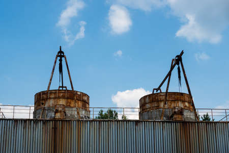 Closed cooling towers in an abandoned factory. Photo taken on a sunny day in natural light.の写真素材