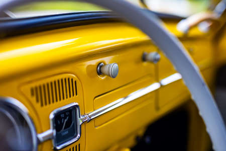 Restored yellow classic car interior. Photo taken in natural light.の写真素材