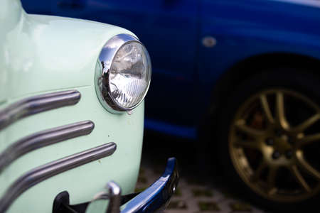 Chrome plated front lamp of a restored classic car. Photo taken in natural light.の写真素材