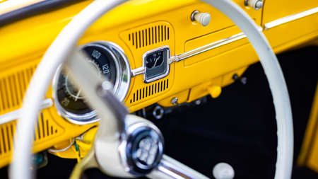 Restored yellow classic car interior. Photo taken in natural light.の写真素材