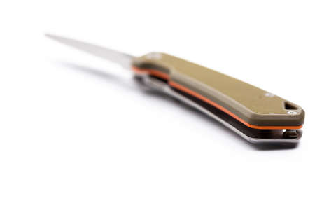 A small folding hunting knife isolated on the white background. Photo taken under soft artificial light.の写真素材