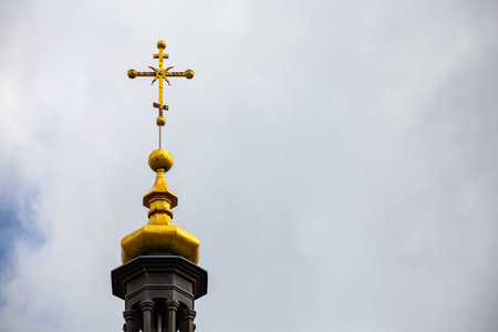 Orthodox cross on top of the church against the cloudy sky. Photo taken in natural light of cloudy dayの写真素材