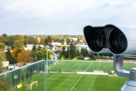 Large, stationary observation binoculars mounted on the observation deck. The binoculars are mounted on a solid, rotating column. Photo taken in natural, soft light.の写真素材
