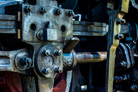 A close-up of a steam locomotive's propulsion system. Steam locomotive standing on the tracks, photo taken in natural lighting conditions.の写真素材