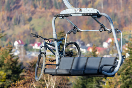 Downhill bicycle on a chairlift. Transportation of downhill bikes to the top of the mountainの写真素材