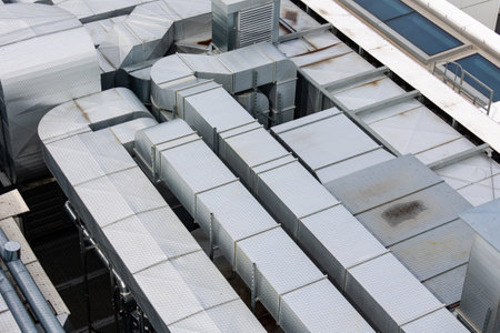 Ducts of the ventilation and air conditioning system on the roof of the building. The photo was...