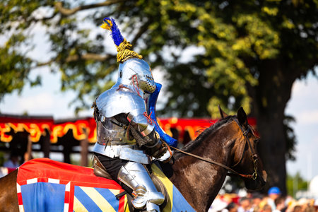 Golub DobrzyÅ„, Poland, Masovian Voivodeship, July 7, 2023. A heavily armed knight wearing...