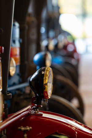 Vintage, colorful tractors in the museum. Agricultural machinery used in land cultivation. The beginnings of agricultural mechanizationの写真素材