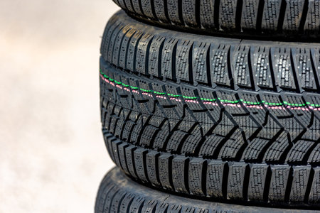 Sharp tread of new winter tires ready for the seasonal change. New tires are important for...