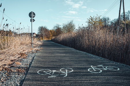 Bike lane in the countryside with bicycle lane and blue sky.