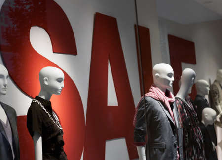 Germany, Munich - July 31, 2010: Display dummies in the summer sales and text Sale.のeditorial素材
