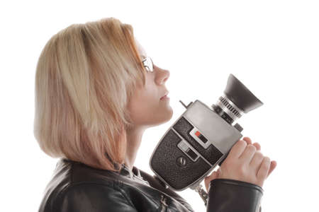 young woman with movie camera, studio shot