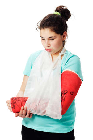 Girl with plaster cast pouting.の写真素材