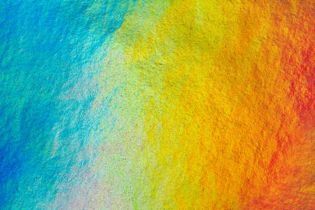 Detail close up of metallic paper in rainbow colors, as a colorful structured background imageの写真素材