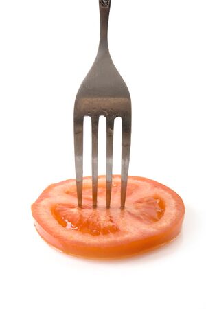 tomato slice on the forkの写真素材