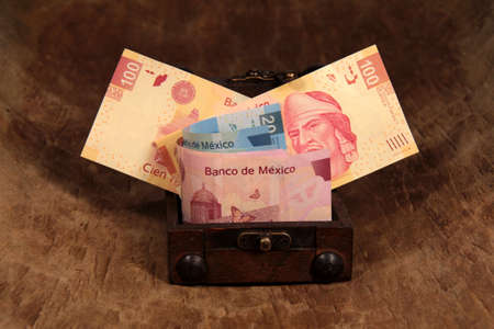 Mexican pesos in the chestの写真素材