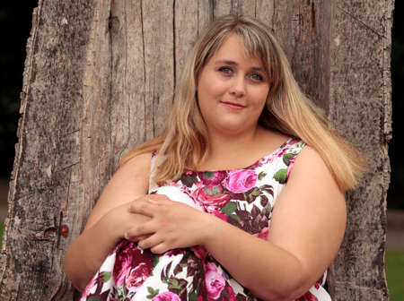 Young plus-size model in summer dress