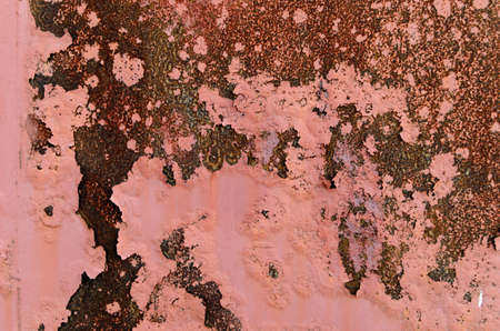 Background of Rusty metal and pink paint.の写真素材
