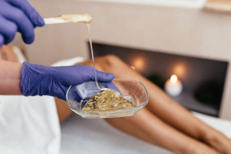 Long Woman Legs. Woman Cares About Her Legs. Sugaring Treatment