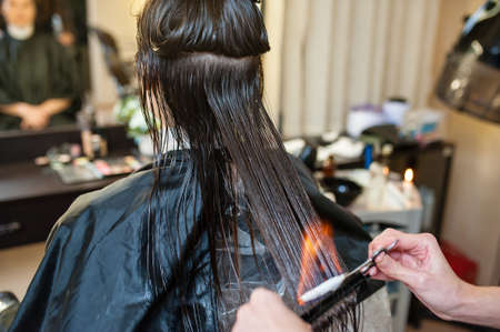 Fire hair treatment in the beauty salon.の写真素材