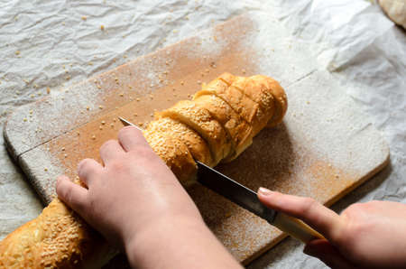 Sliced bread on a wooden board
