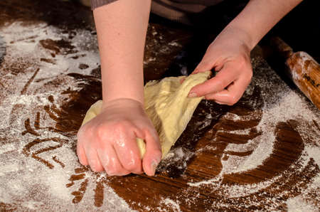 Kneading dough for bread bakingの写真素材