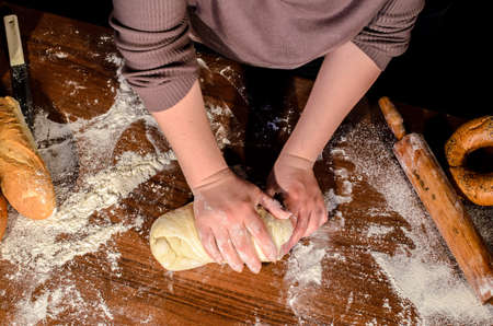 Kneading dough for bread bakingの写真素材