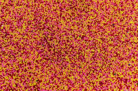 Multicolored background from sugar powder for Easter