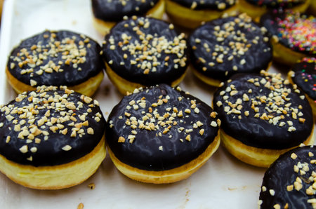 Donuts with chocolate and colorful Toppingの写真素材