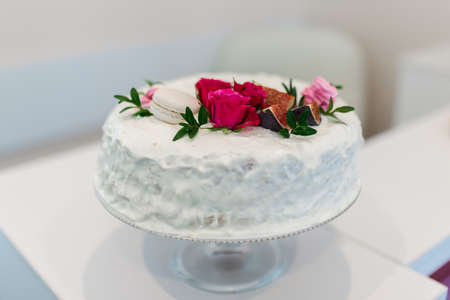 Beautiful white cake with flowersの写真素材
