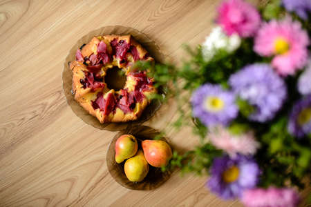 Fruits with flowers on the table