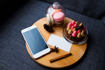 business lunch concept. Phone, business card and a cup of coffee on the table