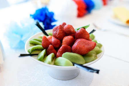 Plate with strawberries and Kiwiの写真素材