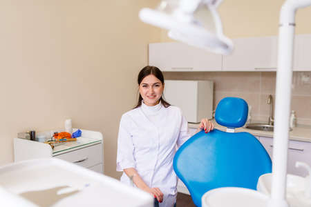 Portrait of female dentist .She standing in her dentist officeの写真素材