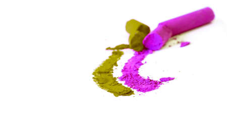 Pressed colored chalk on white paperの写真素材