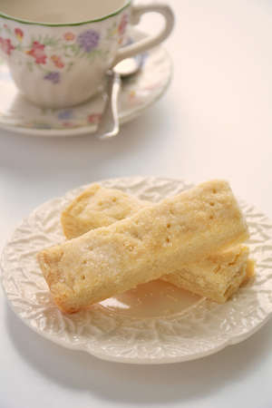 Delicate shortbread fingers in vertical format shot in natural light