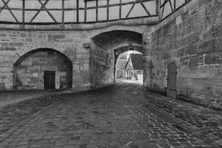 Rothenburg ob der Tauber, Germany - 18 February 2019: The streets of Rothenburg, Bavaria is federal state of Germany. Black and white shots of wintry, deserted Rothenburgのeditorial素材