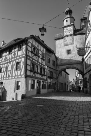 Rothenburg ob der Tauber, Germany - 18 February 2019: The streets of Rothenburg, Bavaria is federal state of Germany. Black and white shots of wintry, deserted Rothenburgのeditorial素材