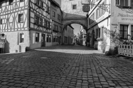 Rothenburg ob der Tauber, Germany - 18 February 2019: The streets of Rothenburg, Bavaria is federal state of Germany. Black and white shots of wintry, deserted Rothenburgのeditorial素材