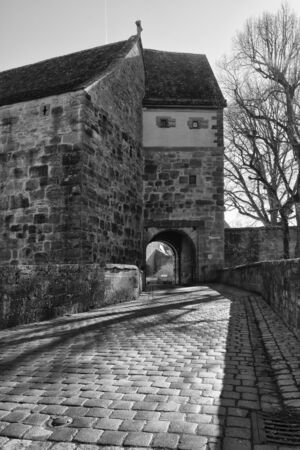 Rothenburg ob der Tauber, Germany - 18 February 2019: The streets of Rothenburg, Bavaria is federal state of Germany. Black and white shots of wintry, deserted Rothenburgのeditorial素材