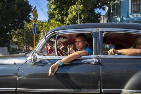 Havana, Cuba - 21 January 2013: The streets of Havana, very old American cars on the streets and...