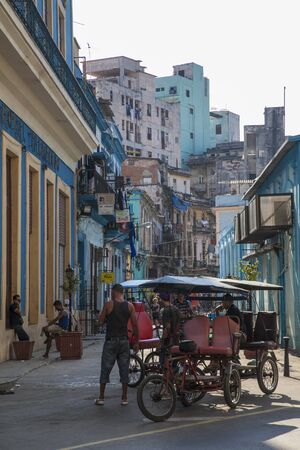 Havana, Cuba - 20 January 2013: The streets of Havana, very old American cars on the streets and...