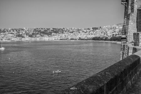 Naples, Italy - August 09, 2015 : On the shores of the sea in Naples. View on stony beach of Naples.のeditorial素材