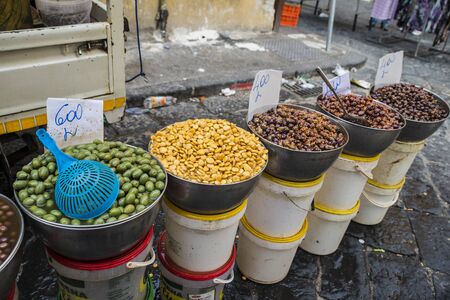 Naples, Italy - August 15, 2015 : Insight on fish market of Naples. Many kinds of different, marinated olives are in vats.のeditorial素材