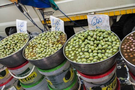 Naples, Italy - August 15, 2015 : Insight on fish market of Naples. Many kinds of different, marinated olives are in vats.のeditorial素材